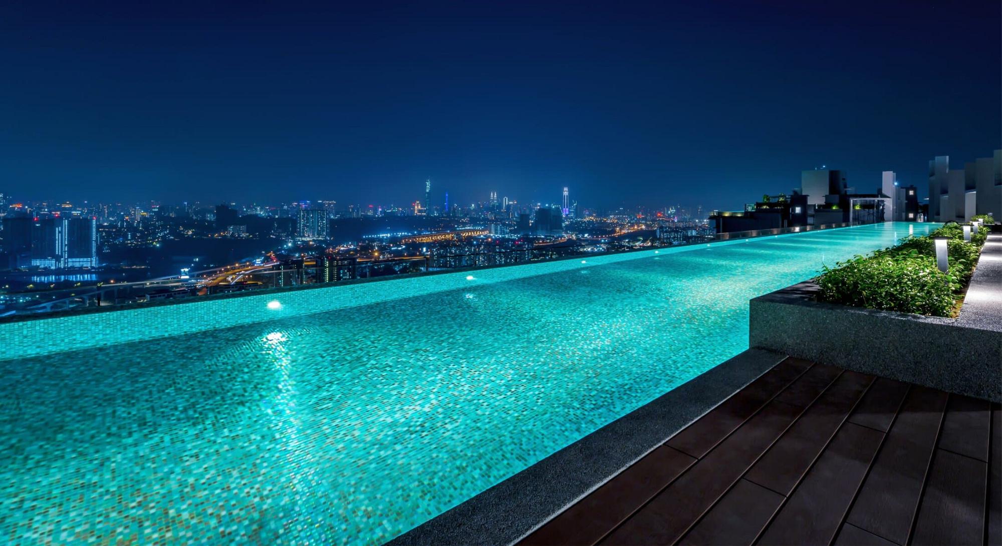 Infinity pool overlooking Los Angeles at night
